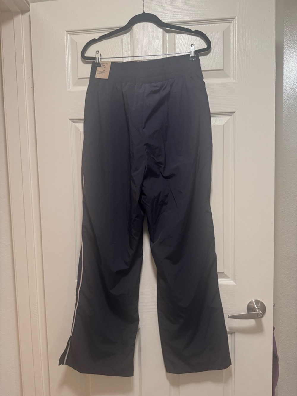 NIKE Asymmetric Waist Water Repellent Pants - Picture 10 of 16
